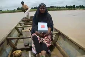 A health worker sails out for vaccination in a hard-to-reach community:  Reaching every child in areas held by Boko Haram in Borno state is now a challenge as polio resurfaces in Nigeria.