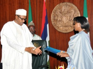 • WHO Regional Director for Africa, Dr Matshidiso Rebecca Moeti presenting the WHO certificate to President Buhari in Abuja.