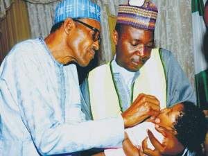 President Buhari administering Oral Polio Vaccine
