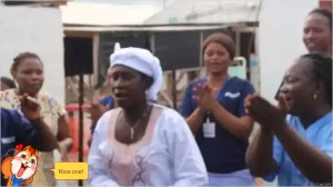 Adama Sankoh, the last confirmed Ebola patient, leaves hospital on August 24, cheered by medical staff. 
